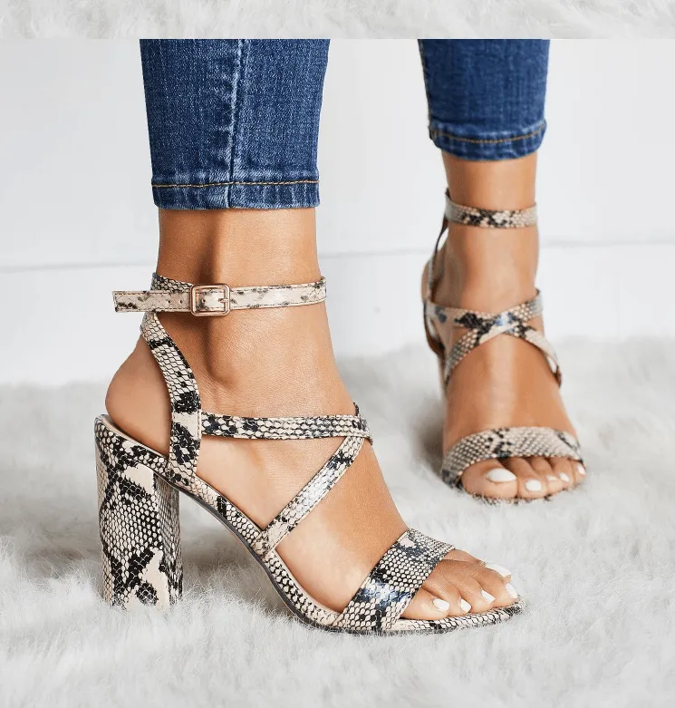Snake-cut hollow high heel sandals